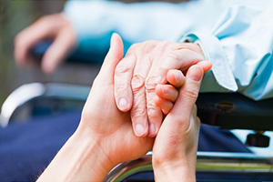 close up image of two people holding hands
